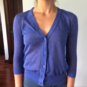 Light purple button up sweater.